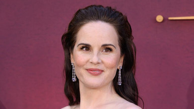 43-річна зірка Абатства Даунтон Докері на парадному хіднику ефектно розсекретила свою вагітність. Фото