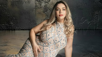 Дружина Маліновського в розцяцькованому камінчиками боді та рюшах показала вагітний живіт на чуттєвих фото з чоловіком