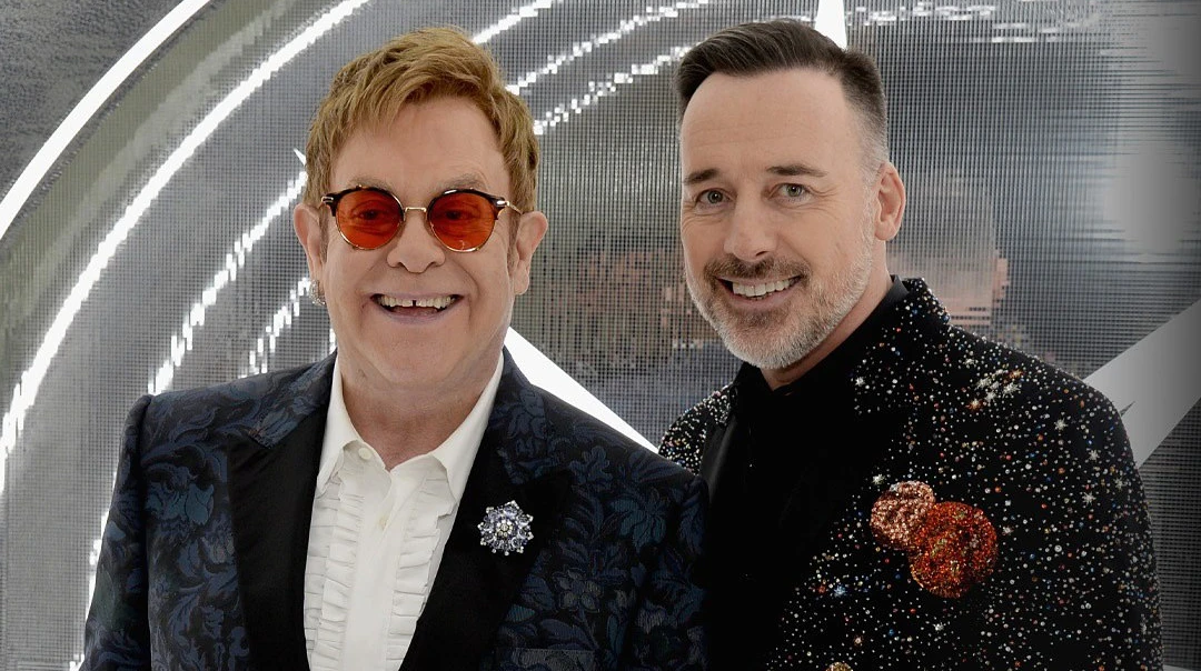 Миттєве кохання і спроба всиновити дитину з України: лавсторі Елтона Джона і його чоловіка