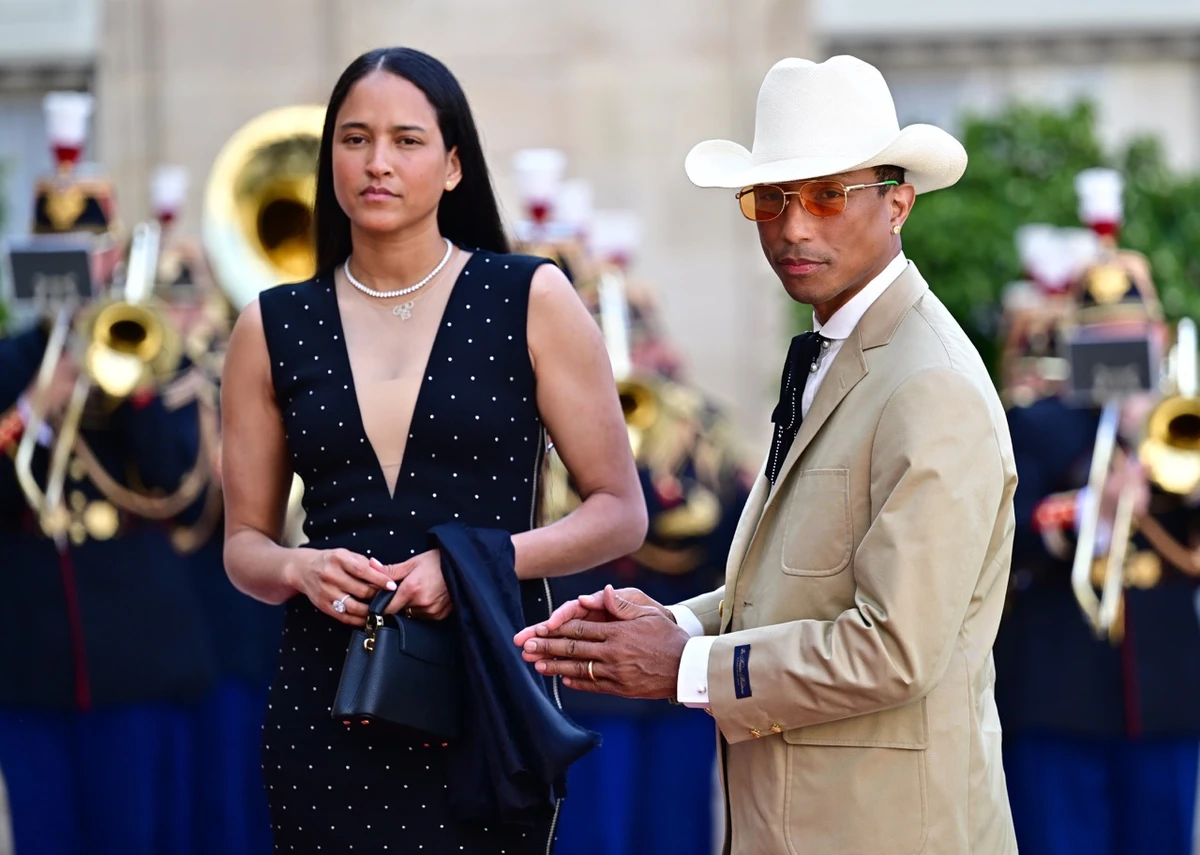 Фаррелл Вільямс із дружиною на прийомі Макрона